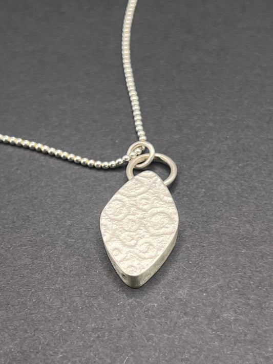 Hollow form, diamond shaped pendant (circles/cells pattern)