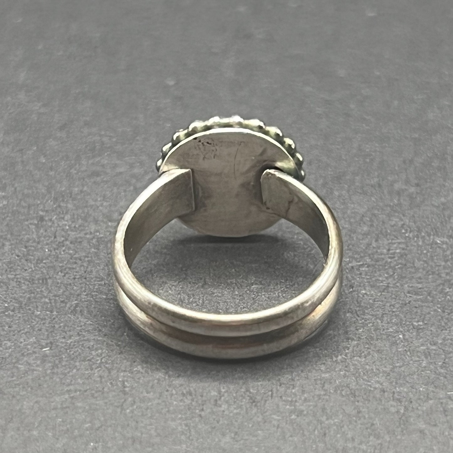 Image shows back side of ring, with split shank band.